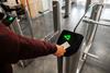 Close,Up,Of,Unrecognizable,Swiping,Card,Passing,Turnstile,To,Enter