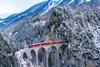 Aerial,View,Of,Train,Passing,Through,Famous,Mountain,In,Filisur,