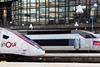 Two SNCF TGV inOui high-speed trains side by side at a station