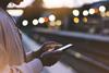 Woman,Waiting,On,Station,Platform,On,Background,Light,Train,Using