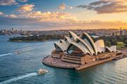 Sydney,Opera,House,At,Sunset,With,Boats,On,Sydney,Harbour