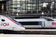 Two SNCF TGV inOui high-speed trains side by side at a station