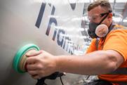 man cleaning train