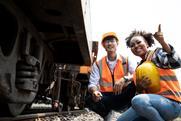 Diversity,Of,Engineers,Working,On,Railway,Train,Station,And,Holding