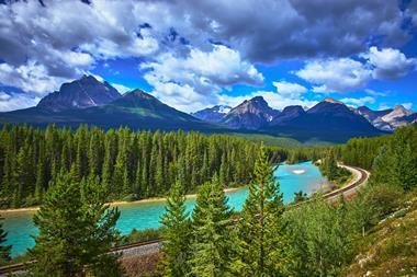 Morant's,Curve,Train,Track,And,River,With,Majestic,Mountain,Landscape