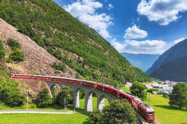 Aerial,View,Of,A,Bernina,Express,Train,Crossing,The,Brusio