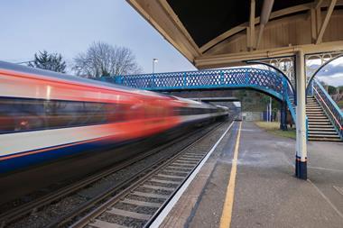 A high speed Network Rail train passing through the station