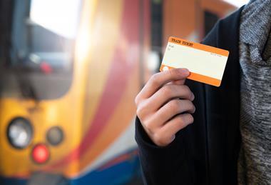 Hand,Holding,One,Blank,Train,Ticket,With,Europe,Train,For