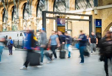 London Train Tube station Blur people movement in rush hour, at