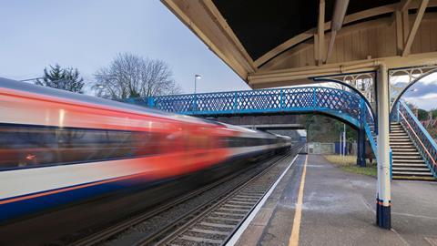 A high speed Network Rail train passing through the station
