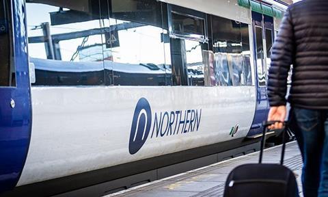 Image shows Northern train at platform with customer on the platform_cropped