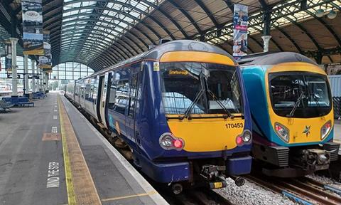 Image shows a Northern train and TransPennine Express train at Hull station_cropped