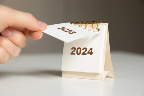 A,Woman's,Hand,Turns,Over,A,Calendar,Sheet.,Year,Change