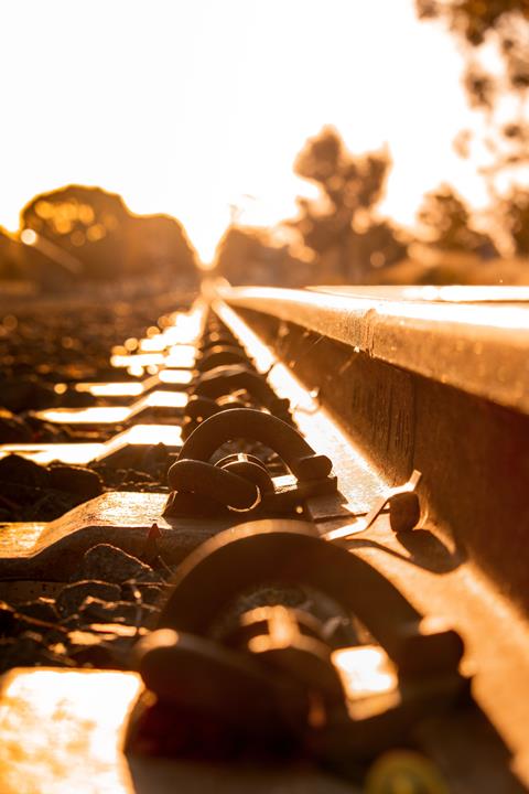 A,Vertical,Shot,Of,Pandrol,Rail,Clip,Fastener,At,Sunset