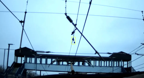 Pantograph view showing overhead line equipment with a highlighted fault (yellow box), captured by the PANDAS system.