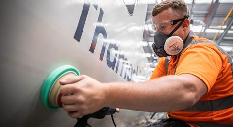 man cleaning train