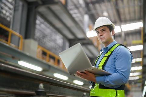 Portrait,Of,Engineer,And,Apprentice,In,Workshop,Of,Railway,Engineering