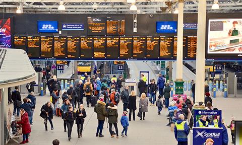 Waverley,Train,Station,,People,Looking,At,Information,Boards,On,The
