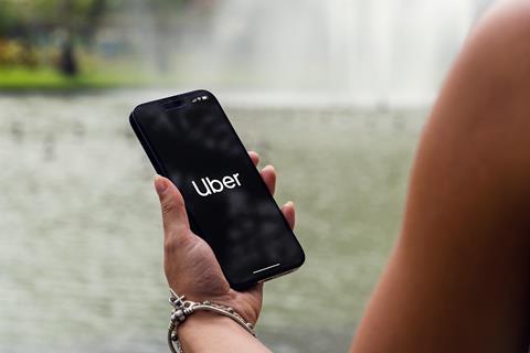 Girl,In,The,Park,Holding,A,Smartphone,Iphone,14,Pro