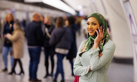 TfL Image - Customer using mobile phone on Elizabeth line platform